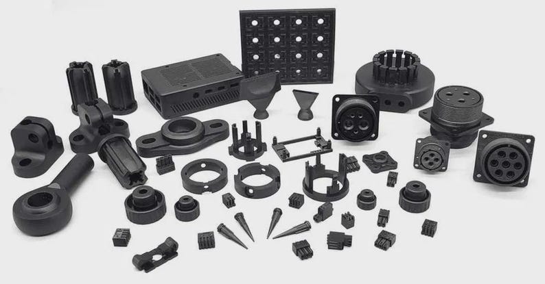 May include: An assortment of black plastic components, including connectors, housings, and various geometric shapes. The collection features circular, rectangular, and conical elements, suggesting a focus on industrial or electronic applications.