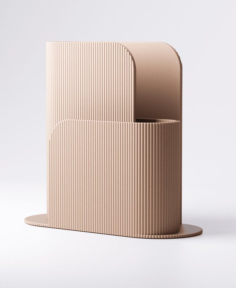 May include: A contemporary, beige vase with a ribbed texture. The vase features a distinctive, curved design with a rounded top and a circular base. The vertical lines create a sense of height and elegance. The vase is likely made of ceramic or a similar material.