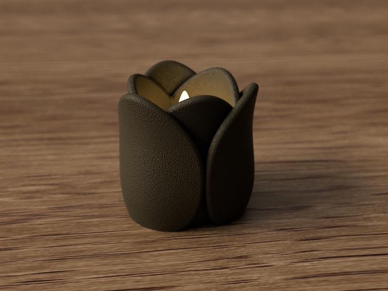 May include: A dark brown, tulip-shaped candle holder with a lit candle inside. The holder has a textured surface and sits on a wooden surface. The candle holder's petals are slightly open, revealing the warm glow of the candle.