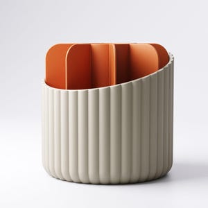 May include: A cylindrical desk organizer with a ribbed, off-white exterior and an orange interior with vertical dividers. The organizer has a curved top edge and a minimalist design, suitable for office or home use.