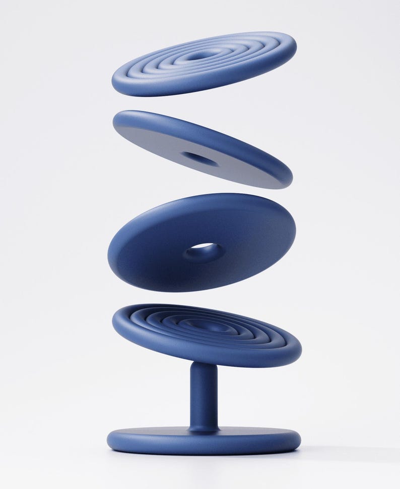 May include: A navy blue, modern chair with a circular base and a central support. The seat features concentric circles, with three additional circular elements floating above. The chair's design is minimalist and contemporary.