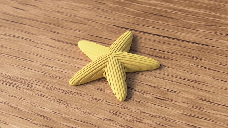 May include: A yellow starfish with a ridged design, resting on a wooden surface. The starfish has five points and a textured appearance. The background is a light brown wood grain.