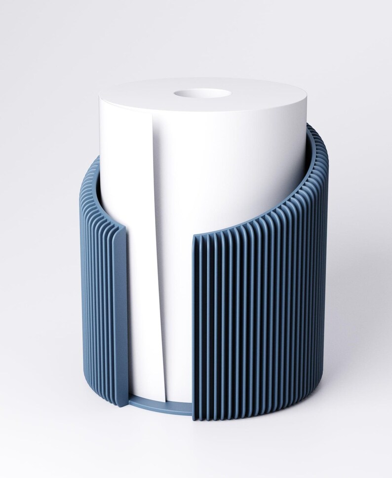 May include: A modern, blue toilet paper holder with a vertical ribbed design. The holder encases a white roll of toilet paper, with a portion of the paper extending out. The design is minimalist and contemporary, suitable for bathroom decor.