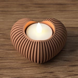 May include: A heart-shaped candle holder with a warm, glowing candle inside. The holder is made of a light brown material with vertical grooves, creating a textured effect. The candle holder sits on a wooden surface.