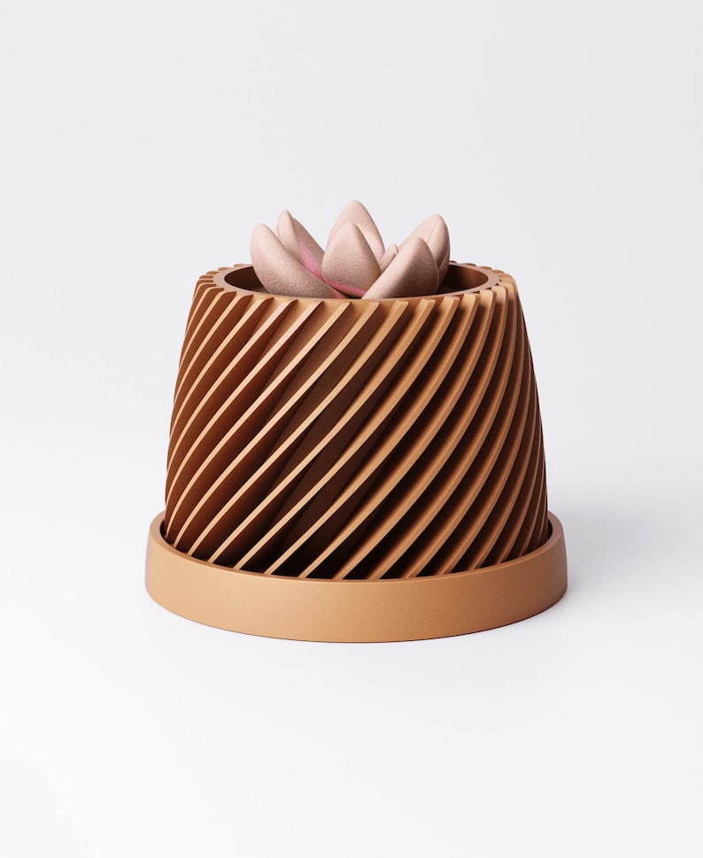 May include: A brown, spiral-patterned planter with a matching saucer. The planter holds a light pink succulent. The design features a series of angled, vertical lines, creating a textured appearance. The overall aesthetic is modern and minimalist.