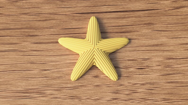 May include: A yellow starfish with textured lines, resting on a wooden surface. The starfish has five points and a slightly rounded shape. The wood grain is visible in the background.