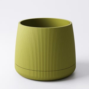 May include: A chartreuse-colored, ribbed planter with a cylindrical shape. The planter has a slightly flared top and a black line encircling the base. The vertical ribs create a textured surface.