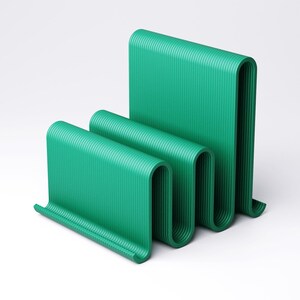 May include: A modern, abstract sculpture in a vibrant teal green. The piece features a series of curved, ribbed panels that create a wave-like form. The design is minimalist and eye-catching, suitable for contemporary decor.
