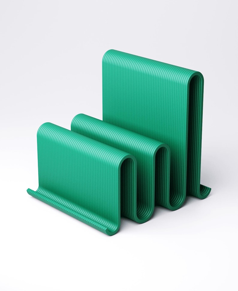 May include: A modern, abstract sculpture in a vibrant teal green. The piece features a series of curved, ribbed panels that create a wave-like form. The design is minimalist and eye-catching, suitable for contemporary decor.