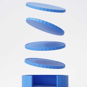 May include: A blue, geometric, modern design featuring a cylindrical base with a circular interior and four floating, circular, blue discs. The discs have a ridged edge. The design is set against a white background.