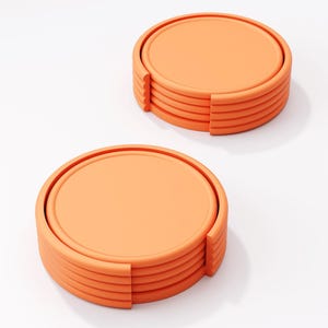 May include: Two stacks of orange coasters. Each coaster is round with a raised edge and a flat center. The coasters are made of a solid material and have a smooth surface. The coasters are designed to protect surfaces from drink rings.