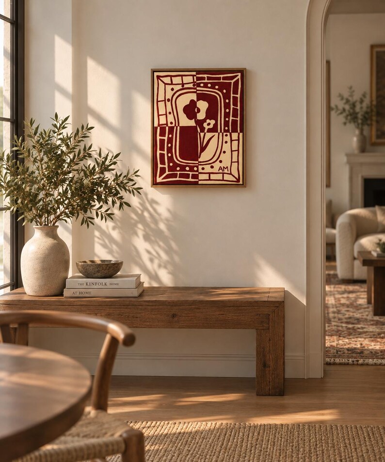 Puede incluir: Una pieza de arte mural rectangular con un dise&ntilde;o de panel dividido en rojo oscuro y crema. La obra muestra motivos florales estilizados dentro de un borde decorativo, con las iniciales AM visibles en la esquina inferior derecha, en un marco.