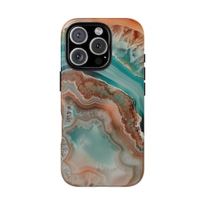 May include: A phone case with a colorful agate pattern in shades of brown, orange, and blue. The case has a cutout for the camera lens.