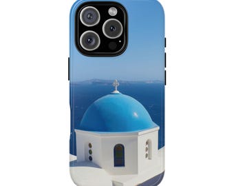 May include: A phone case featuring a vibrant image of a Greek Orthodox church with a bright blue dome and white walls. The background shows the Aegean Sea under a clear blue sky. The case has a glossy finish.