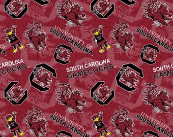 May include: A repeating pattern featuring the South Carolina Gamecocks logo, mascot, and text on a maroon background. The design includes the team's rooster mascot, the block "C" logo, and the words "South Carolina Gamecocks" and "University of South Carolina."