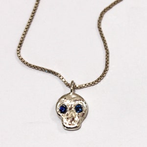Skull friend charm with sapphire eyes image 3