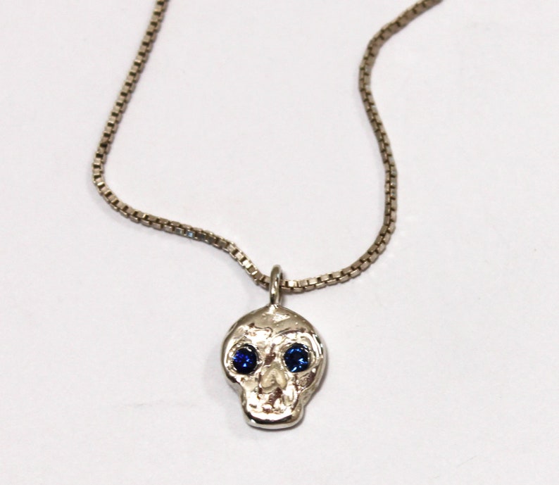 Skull friend charm with sapphire eyes image 3