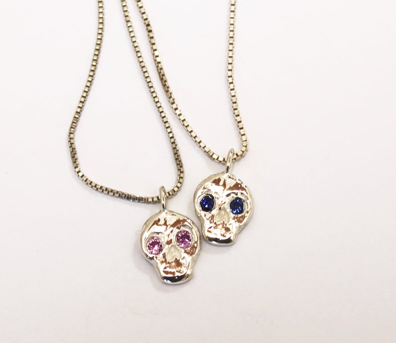 Skull friend charm with sapphire eyes image 1