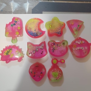 Glow in the Dark Snow globe keychains or badge reels