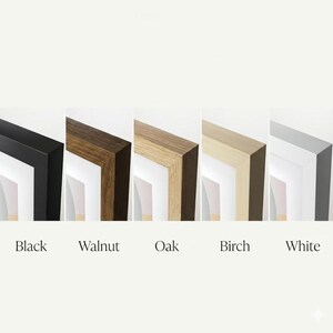 May include: A range of picture frames in black, walnut, oak, birch, and white. Each frame features a white mount and a modern design. The names of the frame colours are displayed below each frame.