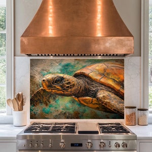May include: A copper kitchen range hood with a backsplash featuring a close-up of a sea turtle with a textured, bronze-colored shell. The turtle is swimming in a turquoise and brown abstract background.