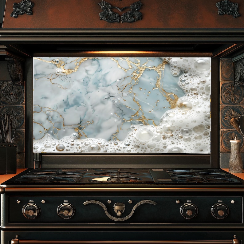 May include: A black and gold stove with a marble and white foam backsplash. The stove has a black top with four burners and a black control panel with three knobs.