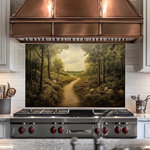 May include: A stainless steel stove with a black cooktop and red knobs. The stove has a backsplash with a painted image of a forest path.