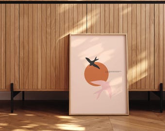 May include: A framed print with a minimalist design featuring two black birds flying over a peach-colored sun on a pink background. The text below the sun reads "To love what is mortal, you must hold it close."