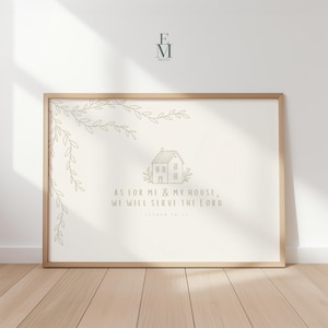 May include: A framed print with a light beige background. The print features a house illustration and the text "AS FOR ME & MY HOUSE, WE WILL SERVE THE LORD". Decorative leaf branches are in the upper left corner. The frame is a light brown color.