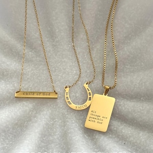 May include: A white ceramic mug with a black handle and the text "But First, Coffee" in a handwritten style. The mug is on a white surface. The mug is likely for hot beverages.