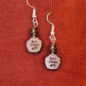Laser cut Love Potion #9 Dangle Earrings