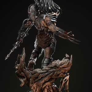 May include: A detailed statue of a Predator alien, standing on a textured wooden base. The figure is clad in armor and carries a spear. The Predator's dreadlocks and mandibles are visible, along with its wrist blades. The statue is predominantly brown and gray.