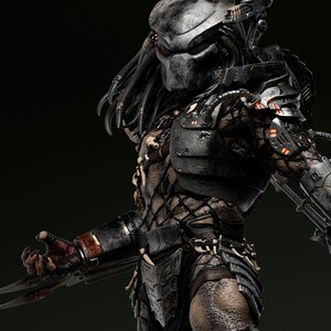 May include: A detailed, three-quarter view of a Predator figure. The figure is predominantly dark gray and black, with intricate armor and dreadlocks. The Predator's mask has a metallic sheen, and its claws are extended.