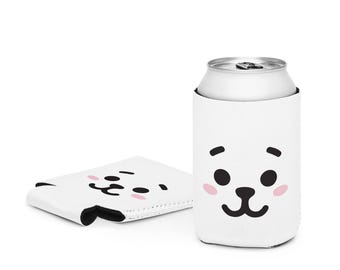 May include: White can cooler with a black and white cartoon face with pink cheeks. The cooler is designed to fit a standard 12-ounce can.