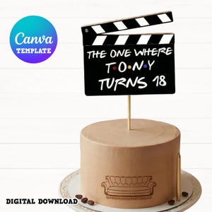 May include: A brown cake with a Friends-themed cake topper that reads "THE ONE WHERE T.O.N.Y TURNS 18". The cake has a sofa graphic and is on a white plate with coffee beans and a gold candle.