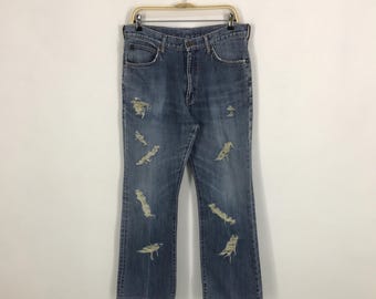Pantalones vaqueros desgastados y rotos Wrangler vintage
