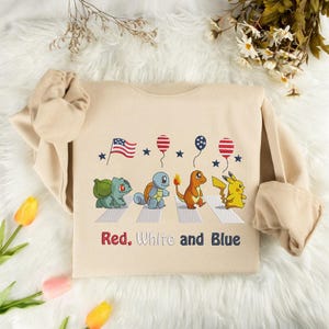 Poke Character Embroidered Sweatshirt, 4th of July Anime Matching Shirt, Independence Gift, Trendy Sweatshirt, Anime Lover Gift ESH4634.DT