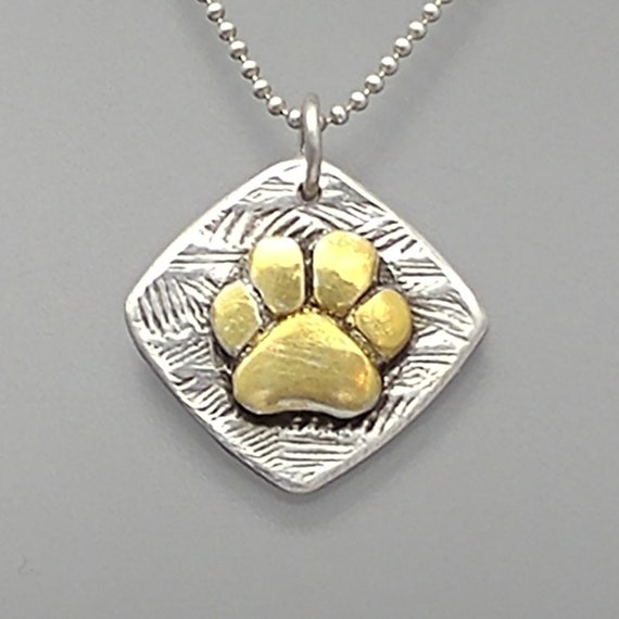 gold dog paw charm