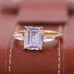 IGI Certified D Color VVS1 Clarity Emerald Cut Three Stone Lab Grown Diamond Engagement Ring, Side Baguettes 14k Rose Gold Ring