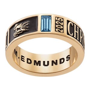 May include: A gold class ring with a black enamel band. The ring features a blue gemstone, the year 2025, and the inscription "M. EDMUNDS" and "CHRISTIAN".