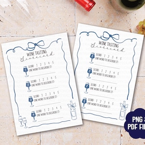 May include: Two white wine tasting scorecards with blue decorative borders and text. The cards include spaces for scoring and describing wines. Wine bottles and glasses are visible in the background. The cards are labelled "Wine Tasting Scorecard".