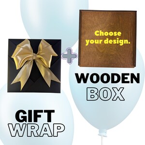 May include: A black gift box with a gold bow next to a wooden box with the text "Choose your design." and "Wooden Box." The words "Gift Wrap" are also displayed.