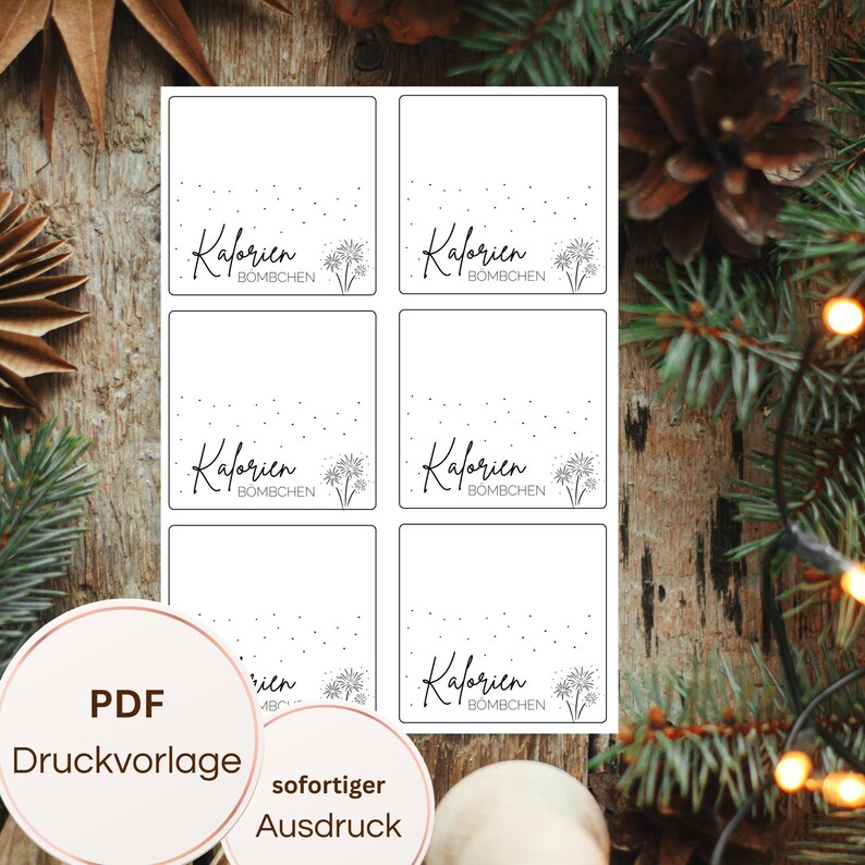 May include: White printable labels with the text "Kalorien Bombchen" in a script font, with a small firework graphic. The labels are arranged in a grid. A circular graphic at the bottom reads "PDF Druckvorlage" and "sofortiger Ausdruck".