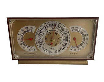 Estación meteorológica de escritorio Taylor Stormoguide vintage con barómetro y termómetro, objeto de colección.