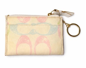 Tarjetero Coach Scribble Signature C Mini Skinny con cremallera, color crema pastel.