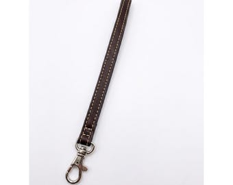 Bracelet en cuir marron foncé Coach avec fermoir mousqueton pivotant argenté classique