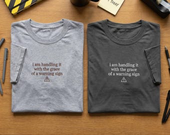 Grace Of A Warning Sign Shirt, Embroidered T-Shirt, Sarcastic Gift, Funny Chaos Tee, Relatable Mood, Warning Symbol Apparel, Quirky Gift