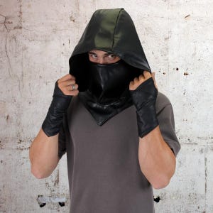 May include: A black leather hooded mask with a face covering. The mask has a pointed hood and a wide collar.