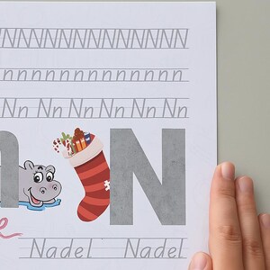 ¡Aprende la letra N de forma divertida! Linda página de práctica para escribir y descubrir: perfecta para que los pequeños se inicien en el abecedario.