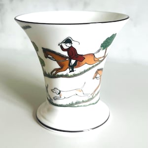 May include: A set of three ceramic nesting bowls in shades of blue, green, and white. The bowls have a speckled glaze and a simple, modern design. The largest bowl is about 20 cm in diameter.